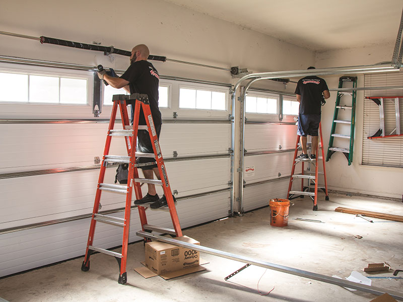 A modern house automation system depends on garage door openers, which are practical and necessary. By letting them open and close garage doors with only the push of a button, these gadgets provide homeowners convenience and safety. Making the right decision depends on knowing the several kinds of Garage Door Openers and their characteristics whether you want to install a new one or replace an existing opener. Garage Door Opener Types Many different kinds of garage door openers exist, each with certain qualities and advantages. Common types are chain drive, belt drive, screw drive, and direct drive openers. Using a metal chain to push the door, chain drive openers are the cheapest and most dependable. For houses with attached garages, belt drive openers are quieter and hence perfect. Using a threaded steel rod to push the door, screw drive openers call for less upkeep. At last, direct drive openers provide silent and smooth operation since their motors go down the track. Important Features to Search For Choosing a garage door opener should involve characteristics that improve convenience and security. Important characteristics are backup batteries, smartphone compatibility, and wireless keypads. While smartphone compatibility lets you manage the opener from a distance, wireless keypads let you open and close your garage door without using a remote. Offering piece of mind, a backup battery guarantees the garage door runs even under power loss. Built-in lights, motion sensors, and automatic reverse safety systems are among other aspects to take into account. Installing a Garage Door Opener Following the correct procedures will help you to install a garage door opener rather easily. Start by selecting the appropriate opener for the size and kind of your garage door. Then, make sure the opener is supported by a solid garage ceiling. First put in the motor unit and mounting bracket; next, connect the chain or belt system and rail. At last, link the opener to your garage door and check it for correct alignment and operation. Although installation can be done as a DIY project, it's usually preferable to engage a professional to guarantee safety and correct operation. Ultimately, for homeowners, garage door openers provide a mix of automation, safety, and convenience. Knowing the several kinds, important characteristics, installation procedure, and maintenance needs will help you to guarantee that your Garage Door Openers keeps operating effectively for years to come.